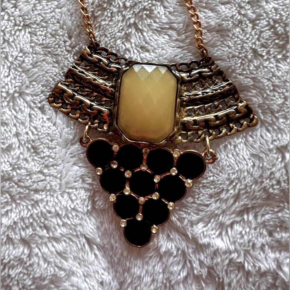 Long black and gold necklace